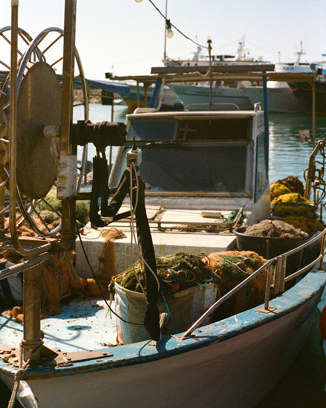 A fishing boat tied up among the fleet