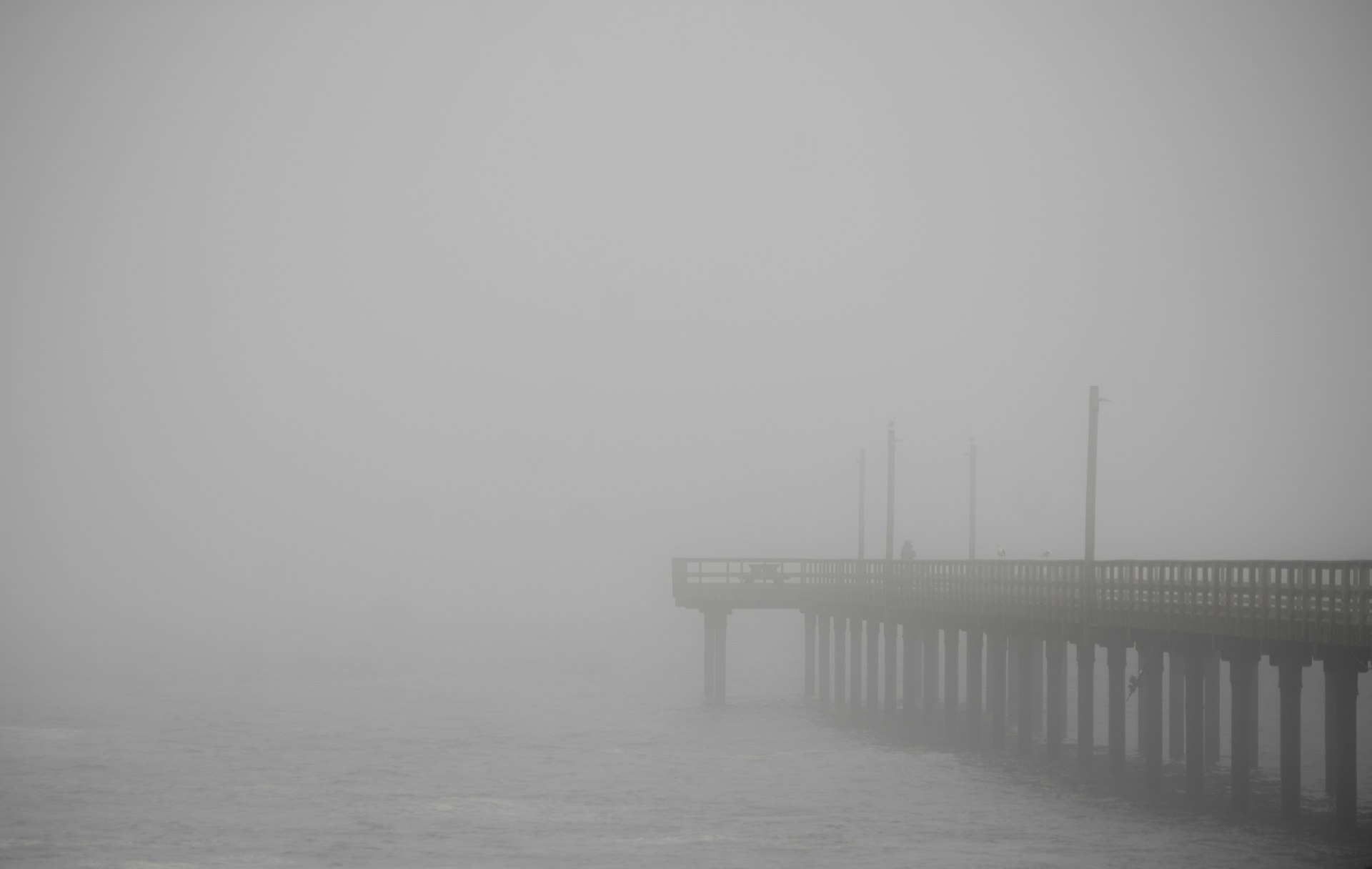 The pier reaching into fog